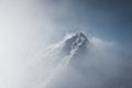 Snowy mountain landscape in cloudy weather near Rossland Range