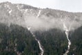 Snowy mountain peaks in the clouds above the Fraser River in British Columbia, Canada Royalty Free Stock Photo