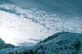 Snowy mountain peaks. Mountain landscape. Winter in the mountains. Blue sky and clouds. White snow. Royalty Free Stock Photo