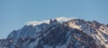 Snowy mountain peaks. snow cliffs top view Royalty Free Stock Photo