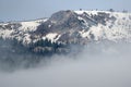 Snowy Mountain Peaks Standing Above the Clouds Royalty Free Stock Photo