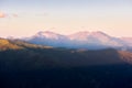 Snowy mountain peaks at sunrise. Golden autumn on the slopes of the mountains of the Caucasus Royalty Free Stock Photo