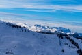 Snowy mountain peaks in the Zell am See area of Austria. In the background is a blue sky with dramatic clouds Royalty Free Stock Photo