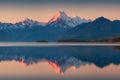 Snowy mountain range reflected in the still water of Lake Pukaki, Mount Cook, South Island, New Zealand. The turquoise water.