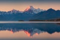 Snowy mountain range reflected in the still water of Lake Pukaki, Mount Cook, South Island, New Zealand. The turquoise water. Royalty Free Stock Photo