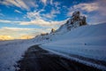 Snowy mountain road in winter landscape near Passo Giau in Dolomites, Italy Royalty Free Stock Photo