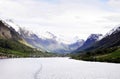 Snowy Mountain, Sunny Valley and Waterfront Scene Royalty Free Stock Photo