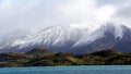 Snowy Mountain towering over lake wanaka New Zealand Royalty Free Stock Photo