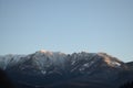 Snowy mountain under the plain blue sky Royalty Free Stock Photo