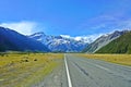 Snowy mountain view with highway in the forefront