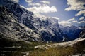 Snowy mountainous landscape of the New Zealand alps with dramatic skies, during a motorhome trip. Royalty Free Stock Photo