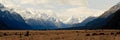 Snowy mountainous landscape of the New Zealand alps with dramatic skies, during a motorhome trip.