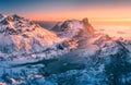 Snowy mountains, blue sea and sky with golden sunlight. Aerial Royalty Free Stock Photo