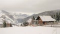 Snowy mountains and a cottage on top Royalty Free Stock Photo