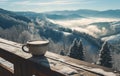 snowy mountains with cup of steamy hot milky coffee on a wooden deck Royalty Free Stock Photo