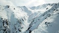 Snowy mountains of Kazakhstan. Opens the view of the gorge, ate growing on the hills and the top of the mountain.