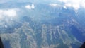 Snowy mountains  View  from plane window Royalty Free Stock Photo