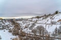 Snowy moutain with road and homes overlooking Salt Lake City downtown in winter Royalty Free Stock Photo