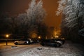 Snowy Night at a Parked Cars Lot Royalty Free Stock Photo