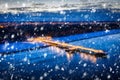 Snowy night at the pier in Brzezno on the beach of Baltic Sea, Gdansk.  Poland Royalty Free Stock Photo