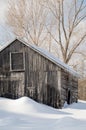 Snowy old log cabin barn with icicles Royalty Free Stock Photo