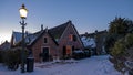 Snowy old traditional dutch houses in the countryside from the Netherlands in winter Royalty Free Stock Photo