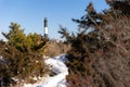 Snowy path leading to a lighthouse in a wintery scene. Fire Island Long Island Royalty Free Stock Photo