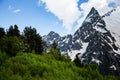 Snowy peaks of Dombai mountains in the late spring