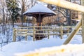 Snowy Photo of the Park on a Sunny Winter day - Wooden Footpath in the Middle of it, Concept of the Harmony and Travel Royalty Free Stock Photo