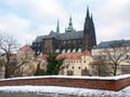 Snowy Prague City with gothic Castle and colorful Trees, Czech Republic Royalty Free Stock Photo