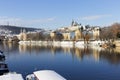 Snowy Prague Lesser Town with Prague Castle above River Vltava in the sunny Day, Czech republic