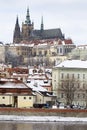 Snowy Prague Lesser Town with Prague Castle above River Vltava, Czech republic