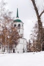 A snowy road leads to a church or cathedral.