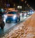 Snowy road with night traffic. City night. Royalty Free Stock Photo