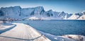 Snowy road on the shore of Norwegian sea. Royalty Free Stock Photo