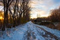 Snowy road at sunset Royalty Free Stock Photo