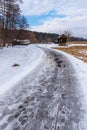 Snowy road to a Traditional Windmill Royalty Free Stock Photo