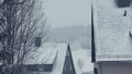 Snowy roofs of family houses. Street of mountain town, village snow calamity.