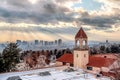 Snowy rooftop with bell tower of a church with Salt Lake City view in the background Royalty Free Stock Photo