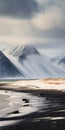 Snowy Beach In Iceland: Mountainous Vistas And Painterly Surfaces Royalty Free Stock Photo