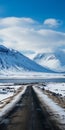 Snow-covered Road Near Mountains: Detailed Marine Views And Serene Mood
