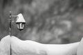 Snowy scene of a frost cover outdoor lamp post. Royalty Free Stock Photo