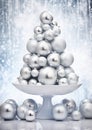 Snowy Silver Ornaments: A Festive Display on a Soft Blur Backgro