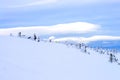 Snowy slope of a mountainous area against