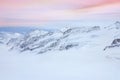 Snowy summits of mount Jungfrau in the Bernese Alps against the backdrop of sunset sky in the pastel color, Switzerland Royalty Free Stock Photo