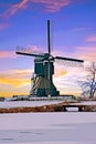Snowy traditional windmill in the Netherlands