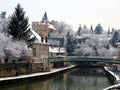 Snowy view on the Briare canal and the castle of Montargis