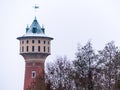 Snowy water tower behind winter trees, Mannheim Germany Royalty Free Stock Photo