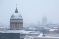 Snowy weather in St. Petersburg, Christmas city, snowfall, view of the dome of the Kazan and St. Isaac Cathedrals