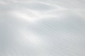 Snowy white hilly abstract winter landscape surface - horizontal background